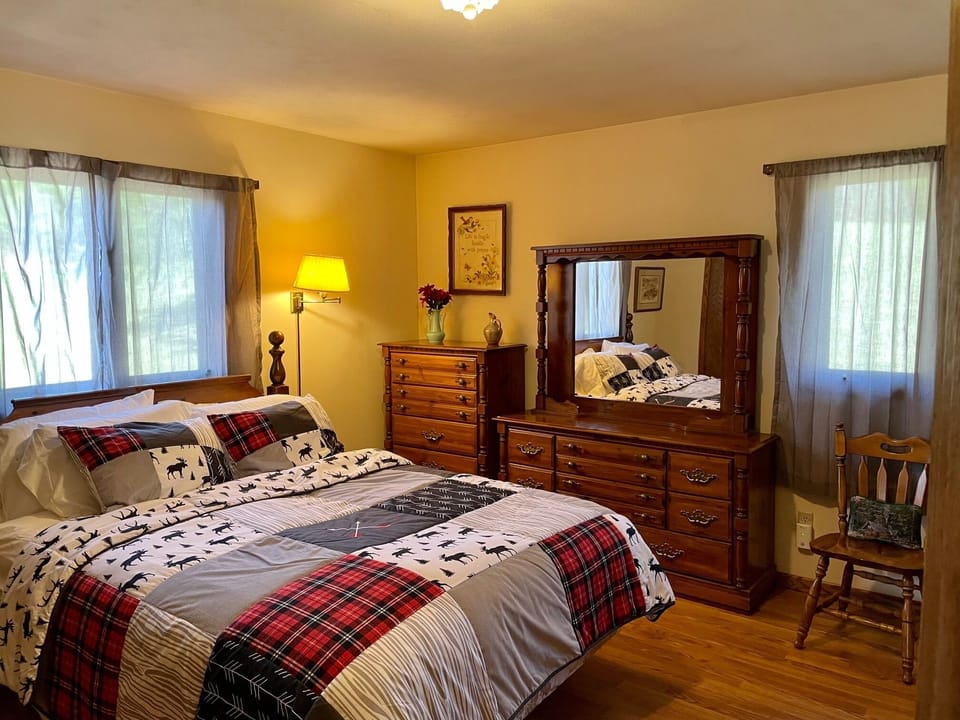 Master bedroom with a king bed and luxurious sheets. 
