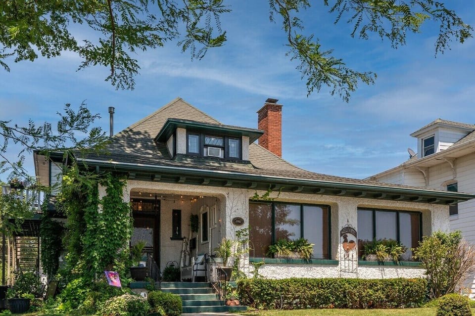 Bungalow exterior from Geneva Street in Downtown Lake Geneva. Private front porch entrance.