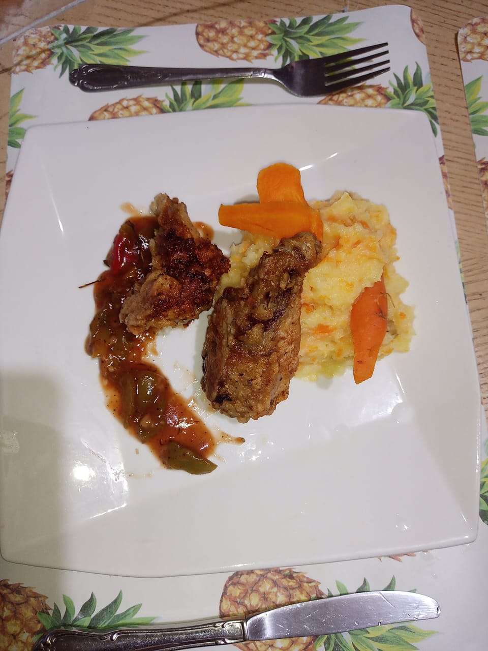 Southern fried Chicken on the bed of mashed potato with carrots and sweet and sa