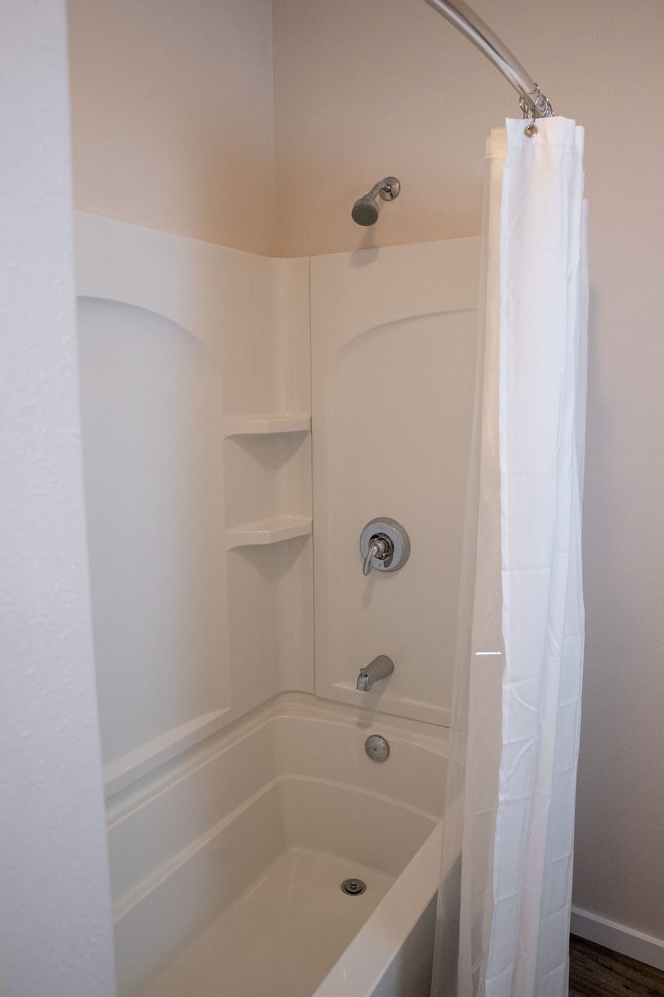 Bathroom with full tub/shower.