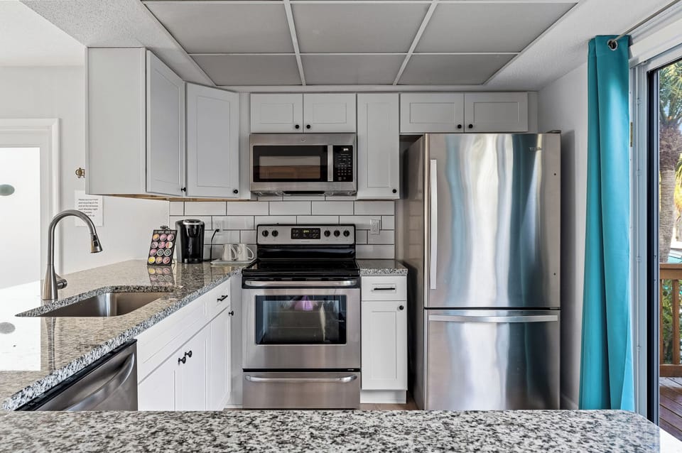 Sleek granite countertops provide plenty of space for food prep.