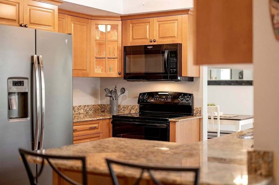 Cozy Kitchen with Stove, Microwave, Fridge and Oven