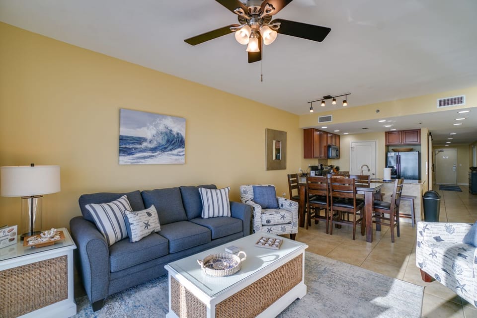 Unwind in your spacious open-concept retreat, where coastal blues and warm woods create the perfect atmosphere for relaxation and memorable meals.