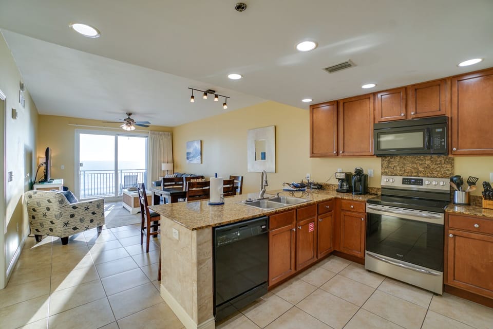 Cook and entertain effortlessly in your spacious open kitchen, complete with granite counters, stainless appliances, and stunning ocean views.
