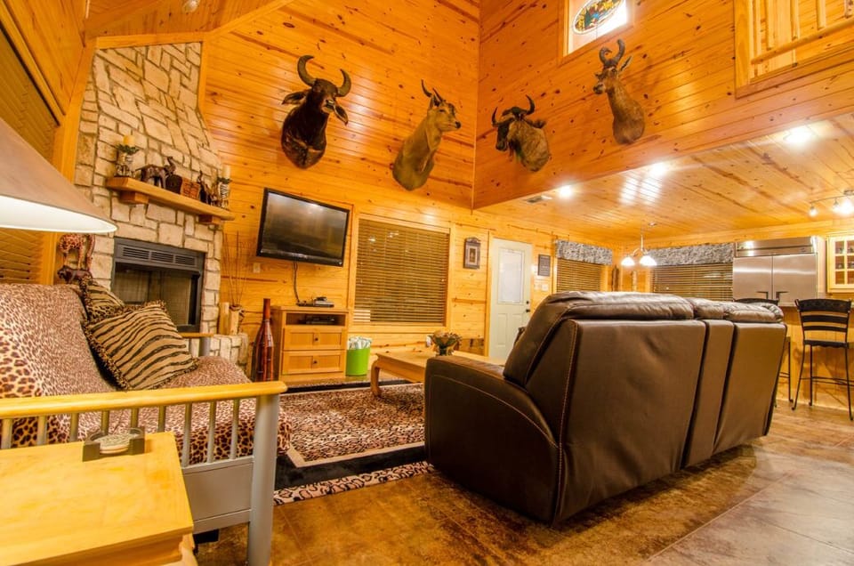 Cozy great room with fireplace, TV, and classic lodge charm