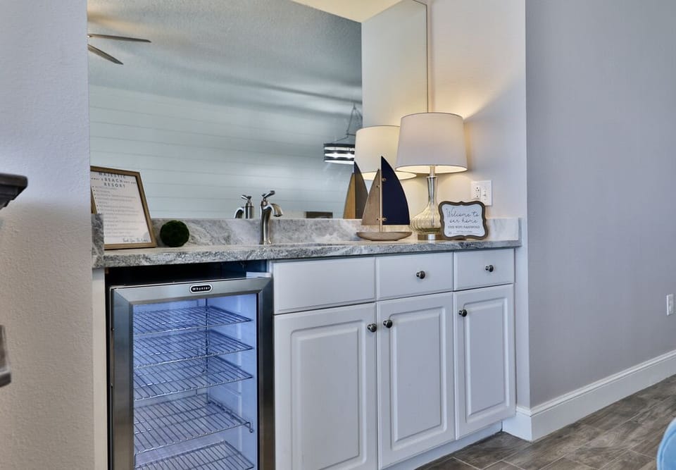 Bar with drink fridge.