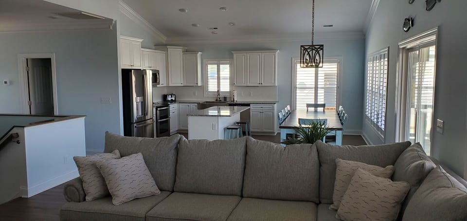 Open concept on main level - kitchen, dining, and living space.