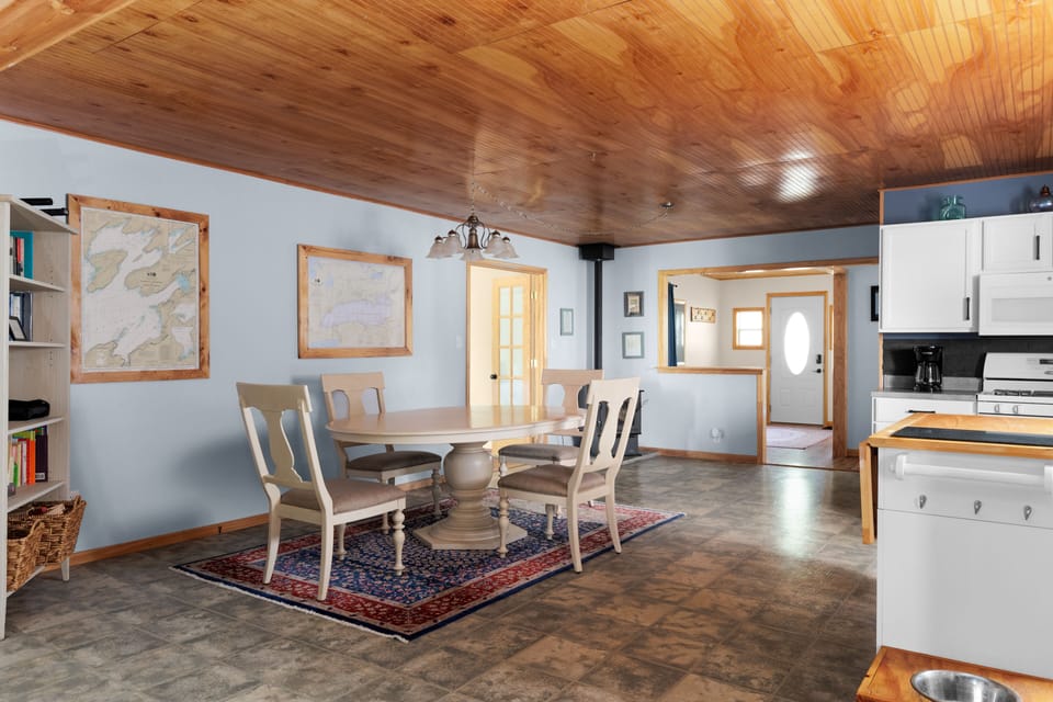 Dining area -- king bedroom through french doors, full bed & bath to the right