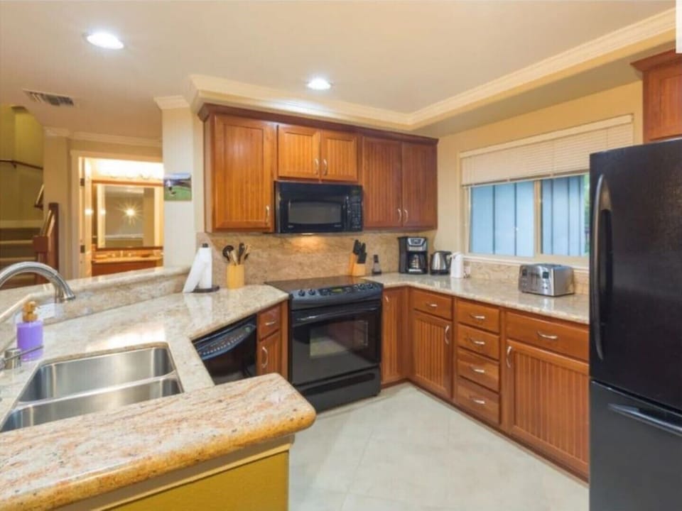 Kitchen area with granite countertops.