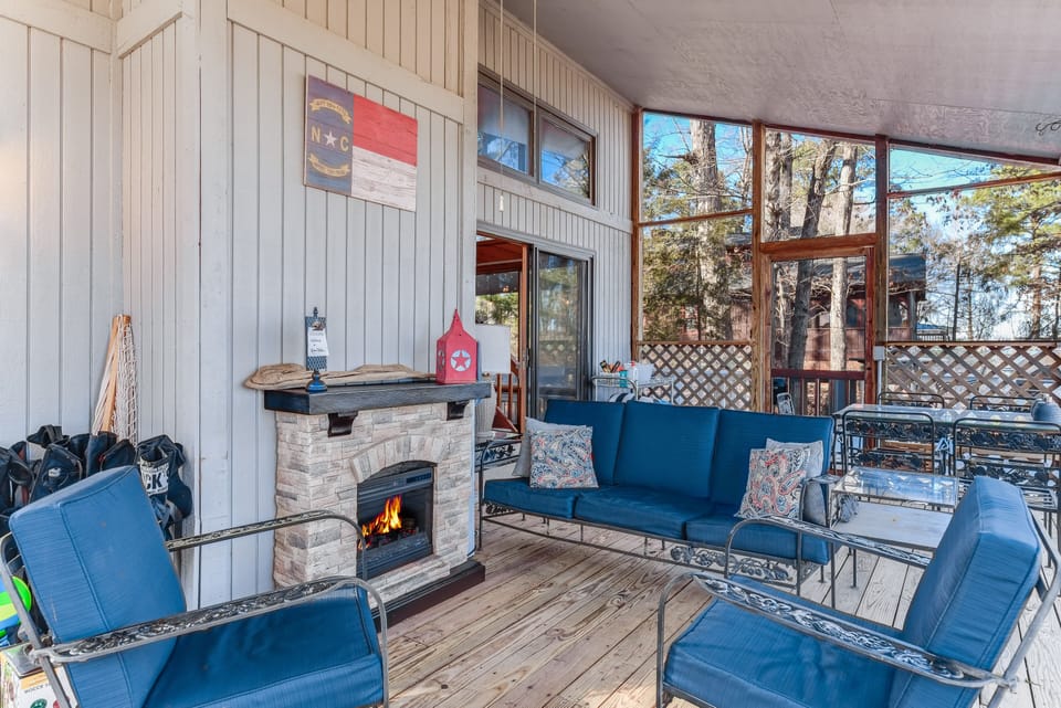 Fun times on the screened in porch with a hanging bed and comfortable seating.