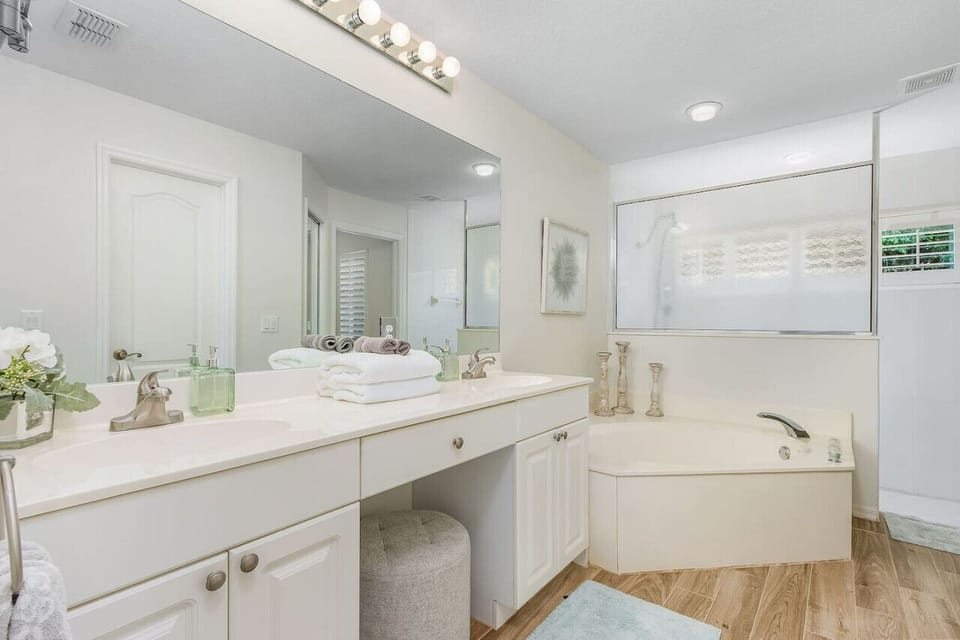 The master ensuite bathroom has a double vanity, large soaking tub, a walk in shower and a separate toilet.