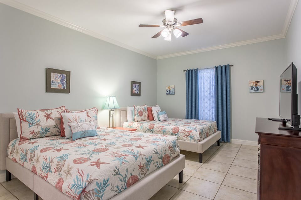 Two Queen beds make the guest room ideal for groups or families.