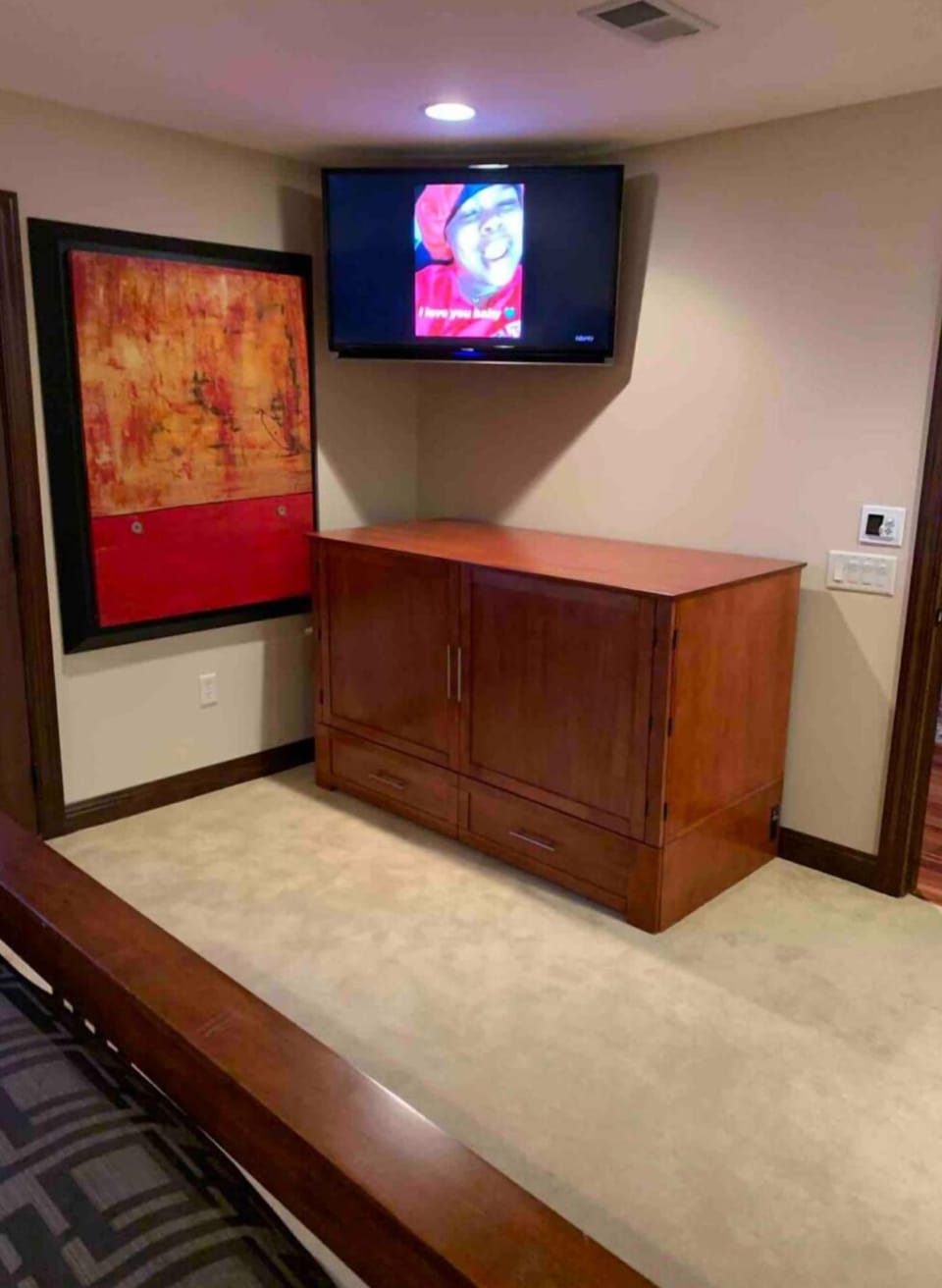 Cabinet pulls out into a queen Murphy bed