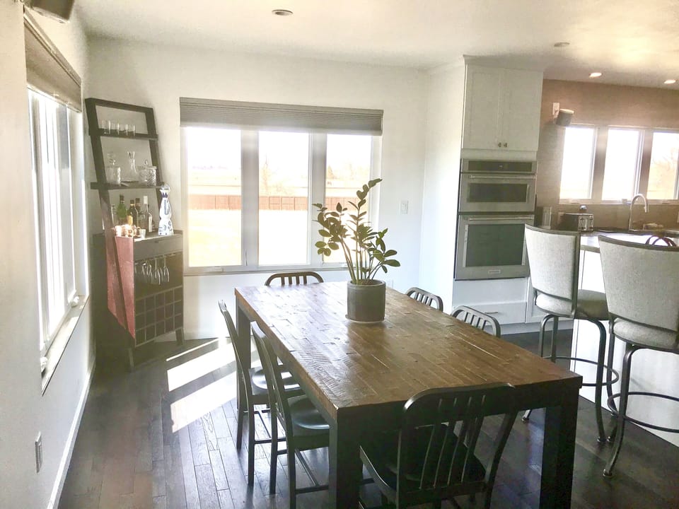 Six-person dining room table, with Mountain views.