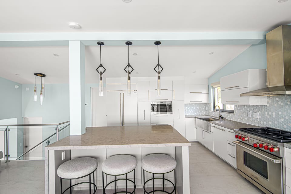 Kitchen is equipped with top of the line appliances and a large island.