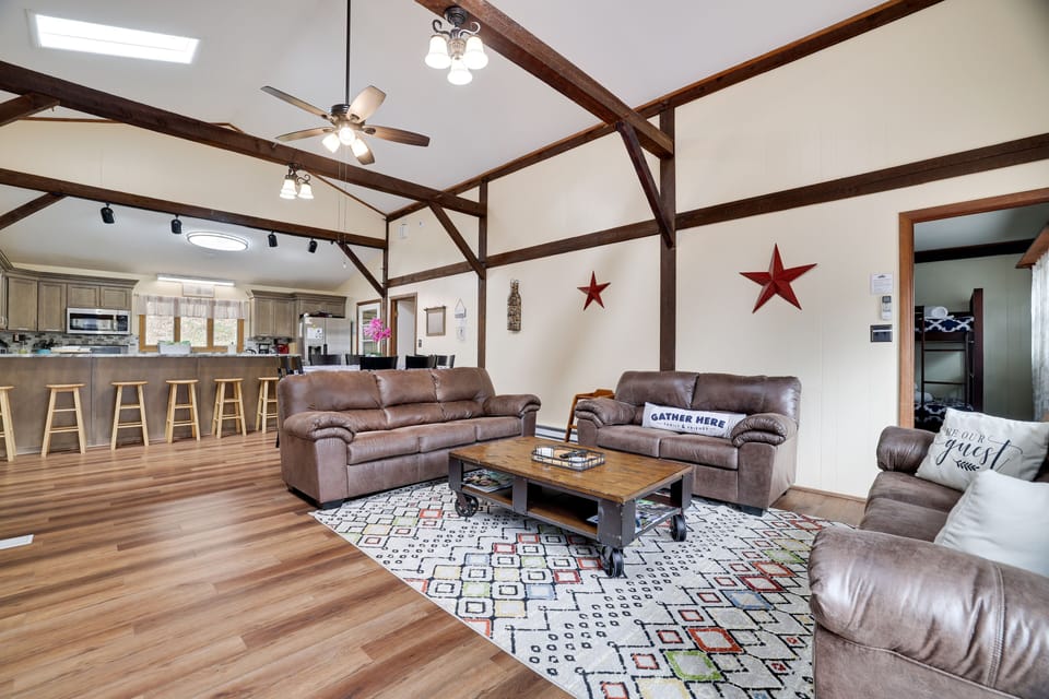 Huge, open concept living room with wood burning fire place and cable TV 
