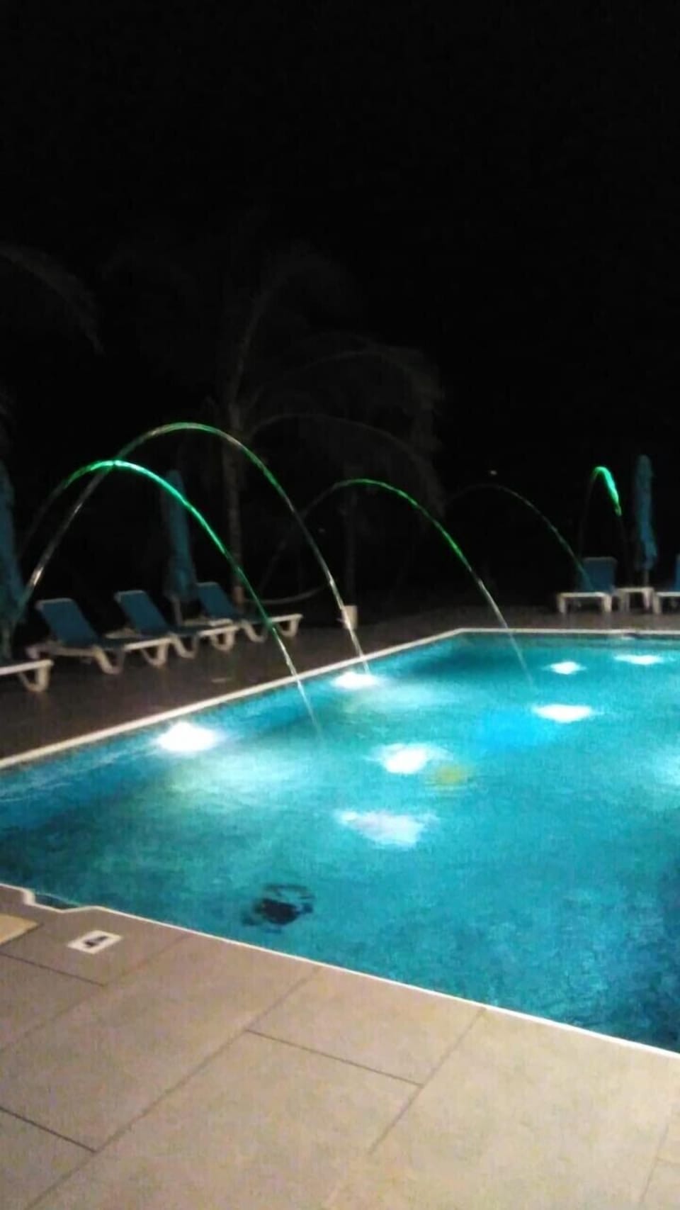 Pool has light/water features for a romantic setting in the evening.