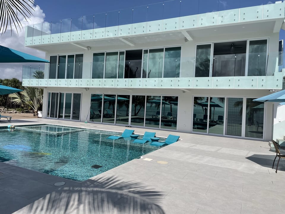 Villa features a poolside level, a  penthouse level & a rooftop level.