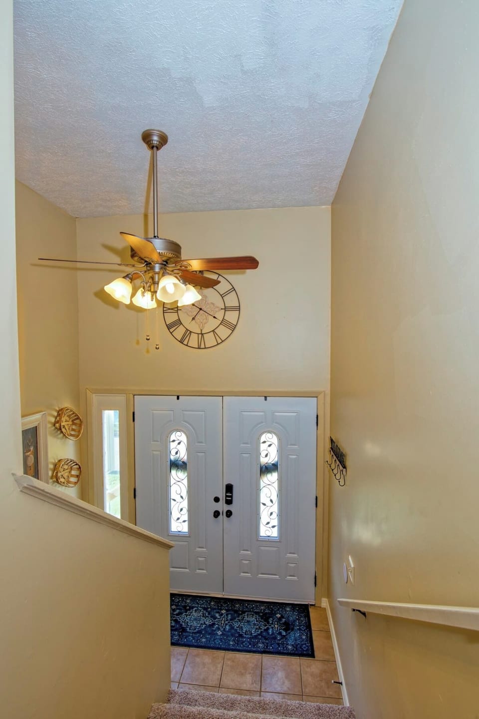 Entrance and the staircase leading to the upper floor.