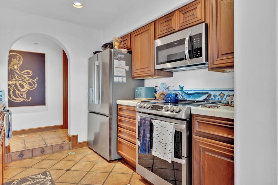 Updated kitchen with new stainless steel appliances.