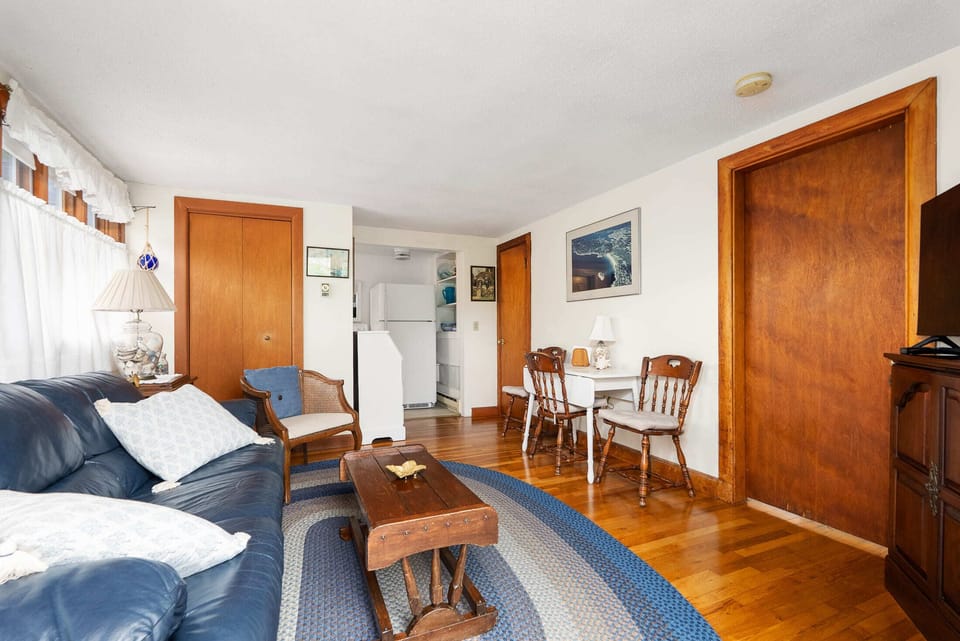 There's a dining nook between the living room and the kitchen.