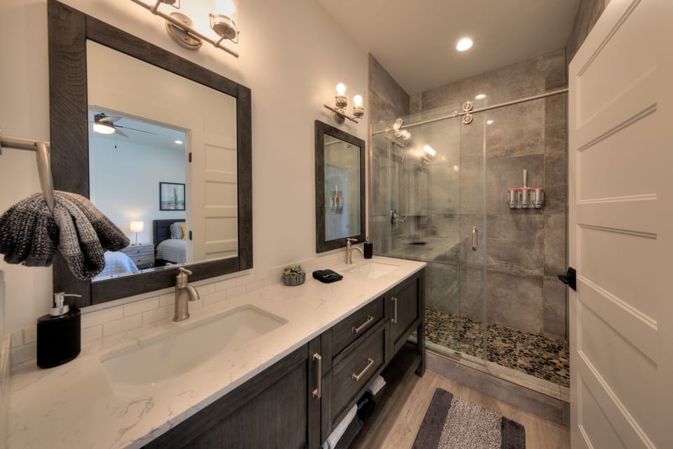 Master bath, double sinks, large walk in shower with sliding glass barn door.