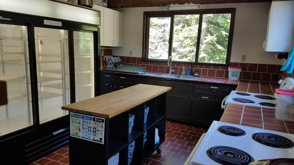 Industrial sized refrigerator (no freezer). 3 part sink. 