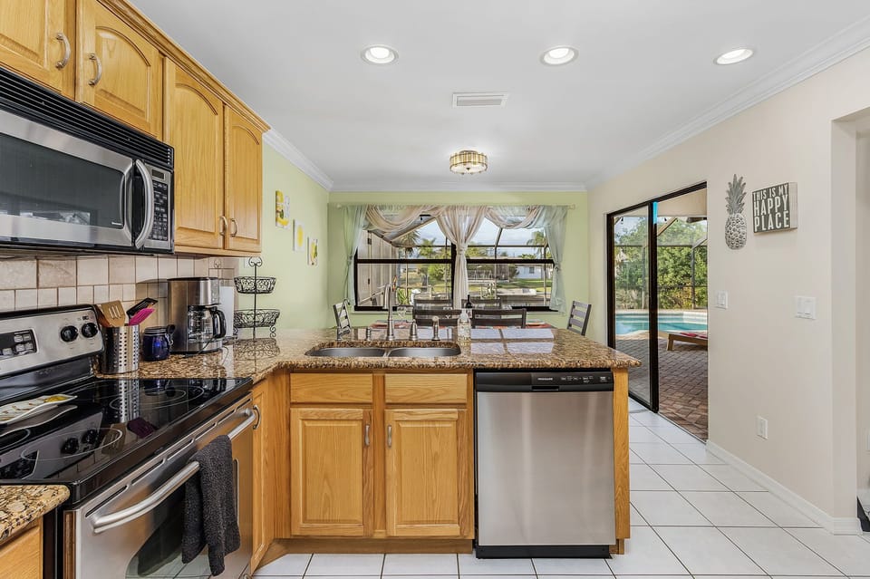 The fully equipped kitchen has stainless steel appliances