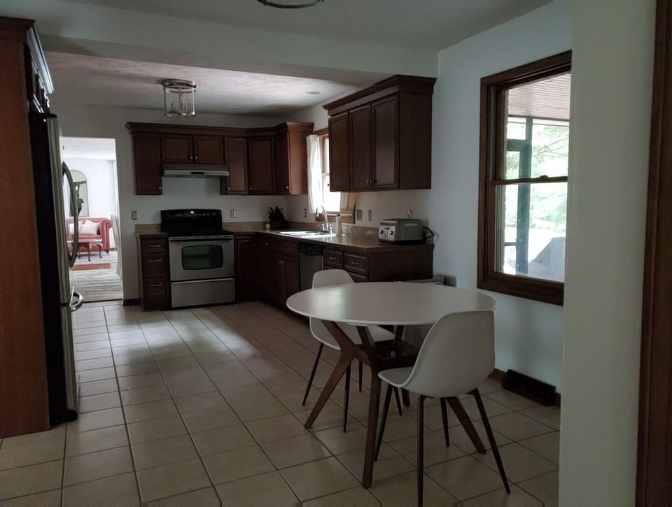 Fully stocked kitchen with dinning for four & eight in dining room
