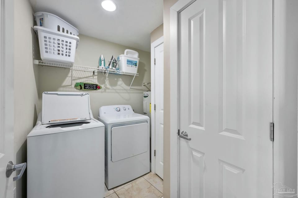 Full size washer and dryer, 2 irons and 2 boards located in condo