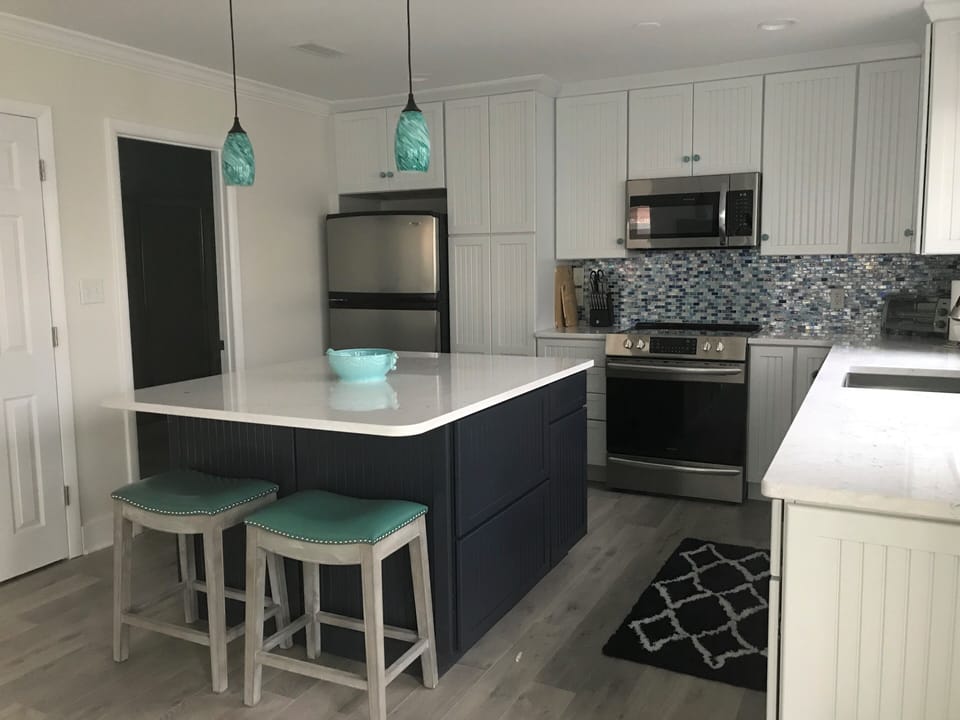 New kitchen.  Full bath to the left of the fridge w/WD
