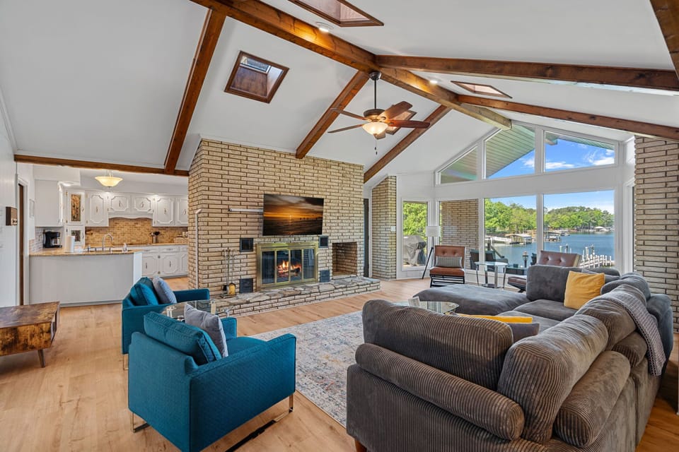 Large living room with tons of seating & lake views.