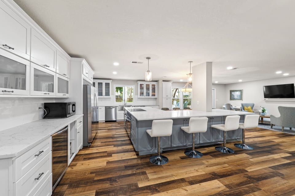Spacious Kitchen with Large Island, Beautiful Granite Countertops, Stainless Steel Appliances, Two Dishwashers, Double Oven, Double Refrigerator, Coffee Bar and Sitting Area with Flat Screen TV