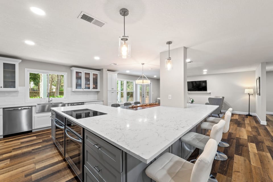 Spacious Kitchen with Large Island, Beautiful Granite Countertops, Stainless Steel Appliances, Two Dishwashers, Double Oven, Double Refrigerator, Coffee Bar and Sitting Area with Flat Screen TV