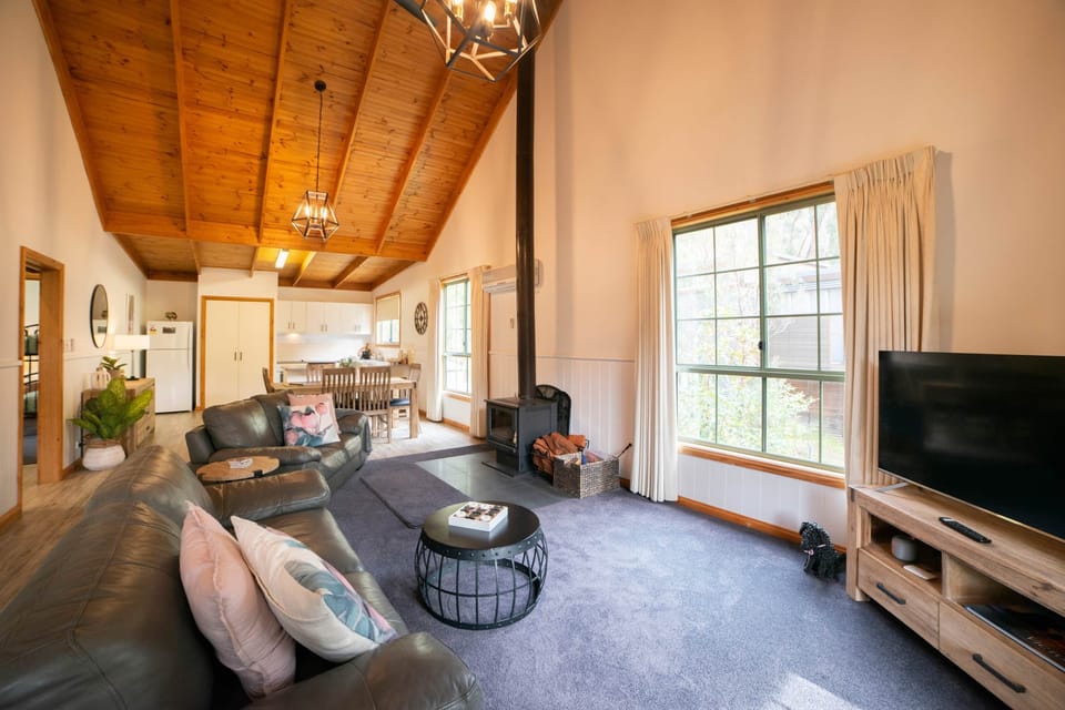 Sink into comfort with cozy couches, plush carpet, and ample space for relaxation.