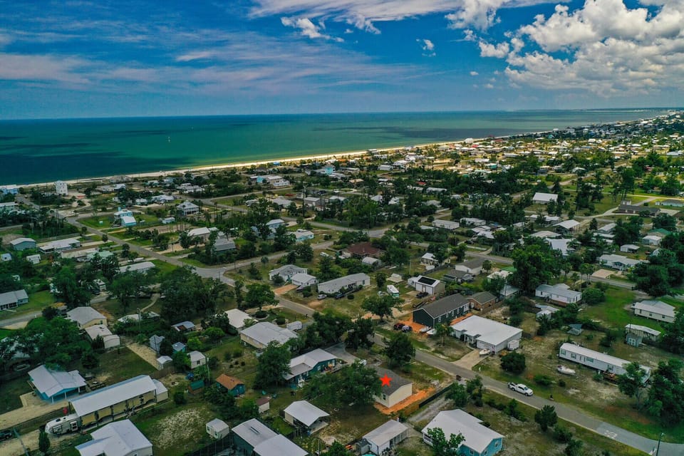 Aerial view of the Gulf with the property location in the foreground.