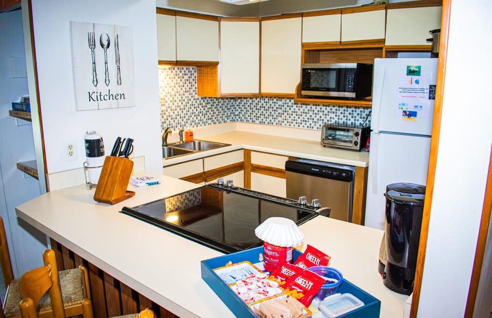 Fully stocked kitchen with additional utensils, tools and supplies