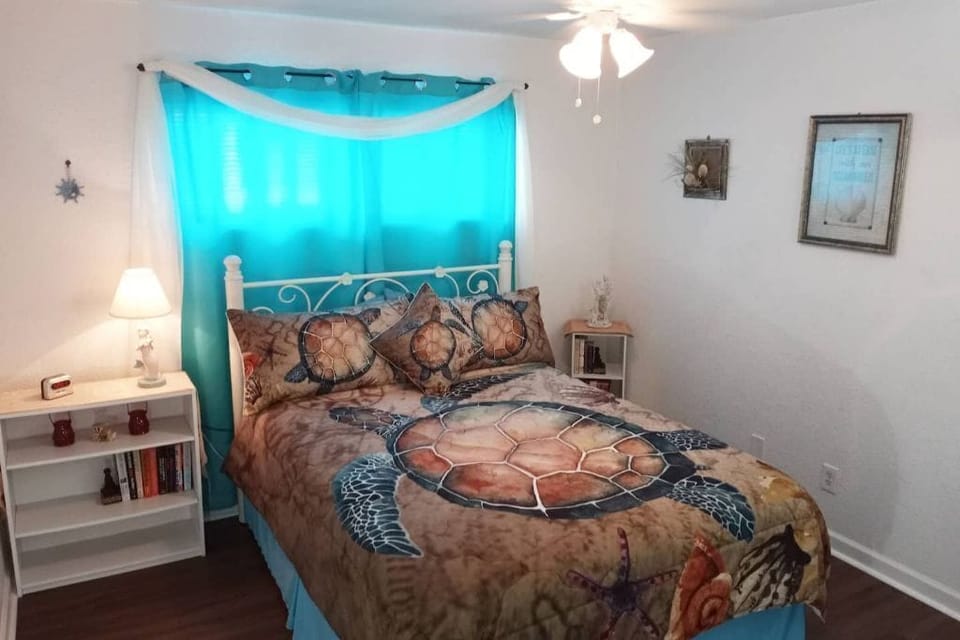 Master bedroom with queen-size bed and Roku-enabled 40' HDTV