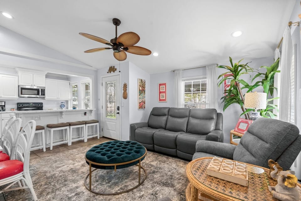 Spacious living room with cozy seating and bright natural light