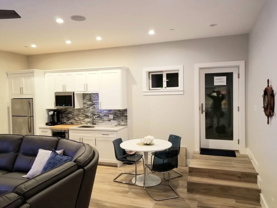 Exterior lower level entrance. Kitchenette & Dining area.