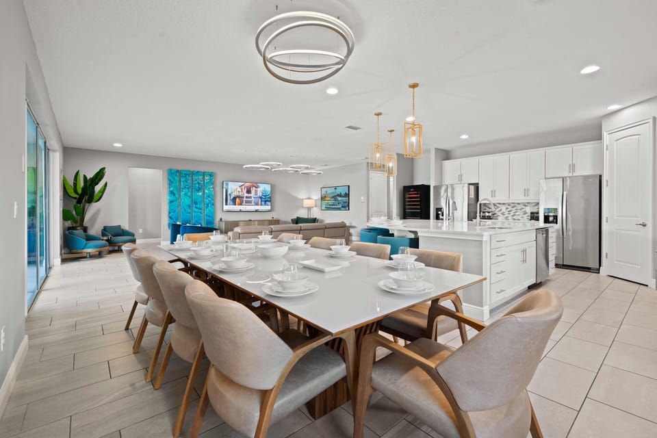 - Spacious open concept living room with modern design  
- Dining table seats large groups for family gatherings  
- Fully equipped kitchen perfect for vacation rental stays