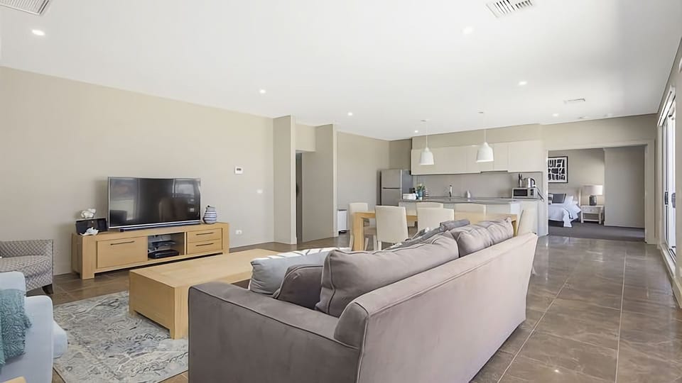 Our penthouse boasts an open plan kitchen and living room, offering a generous space for cooking, dining, and unwinding, all while taking in the breathtaking views that surround you.