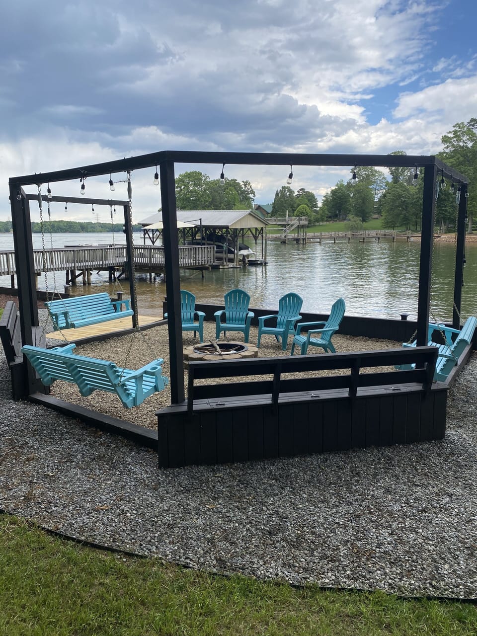 Fire pit, 3 swings, built in benches, Adirondack chairs and lights