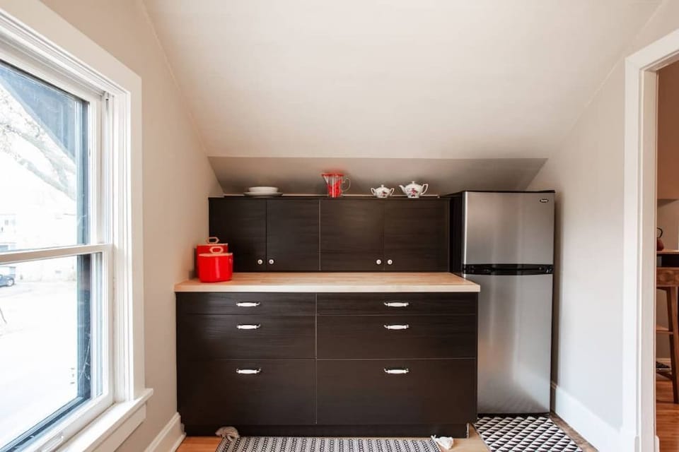 IKEA kitchen - the butcher block counter and euro refrigerator. 