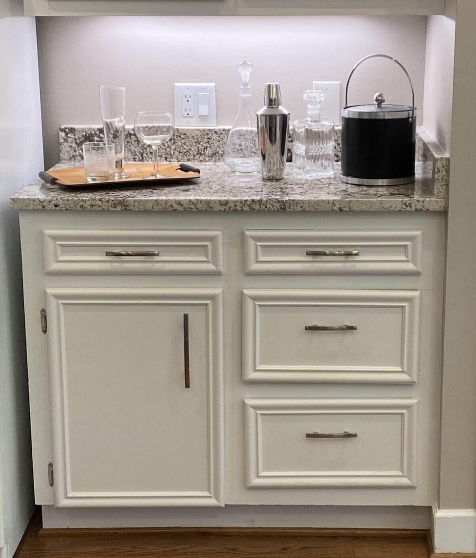 It's five o'clock somewhere! Kitchen Bar Area with Bar glassware and necessities such as corkscrews, bottle openers, koozies, etc.