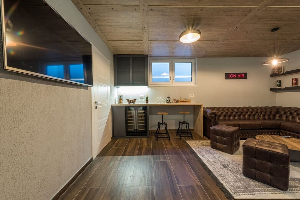 Snacks and drinks corner in the game room of the modern family villa with private pool and sauna