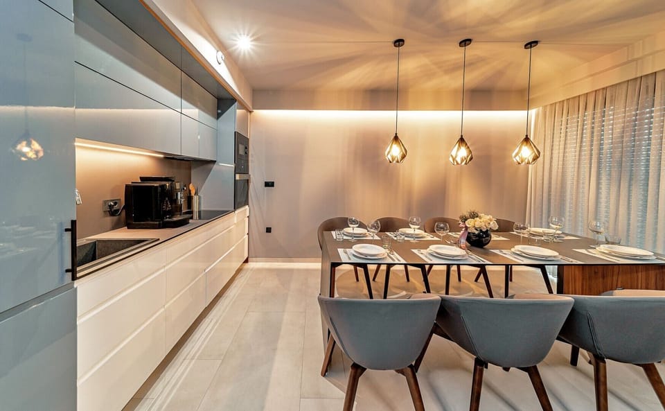Fully equipped kitchen area of Croatia luxury holiday villa with dining table and coffee maker for rent