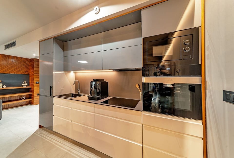 Fully equipped kitchen area of Croatia luxury pool villa with coffee maker and microwave for vacation