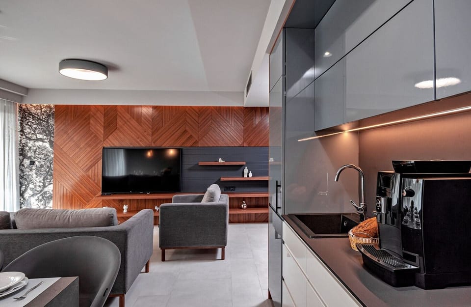 Kitchen area of the luxury Croatia pool villa with dining table and coffee maker for family vacation