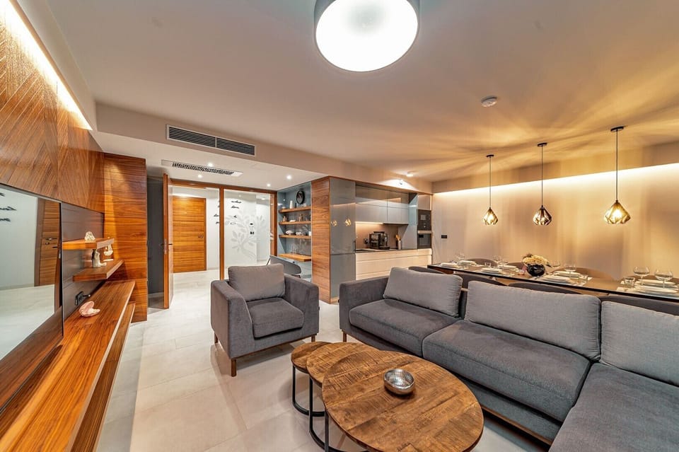 Living room area of Croatia luxury pool villa with sofas and SMART TV for vacation and rent